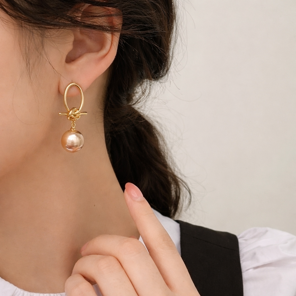 Pendientes Colgantes Dorados con Perla